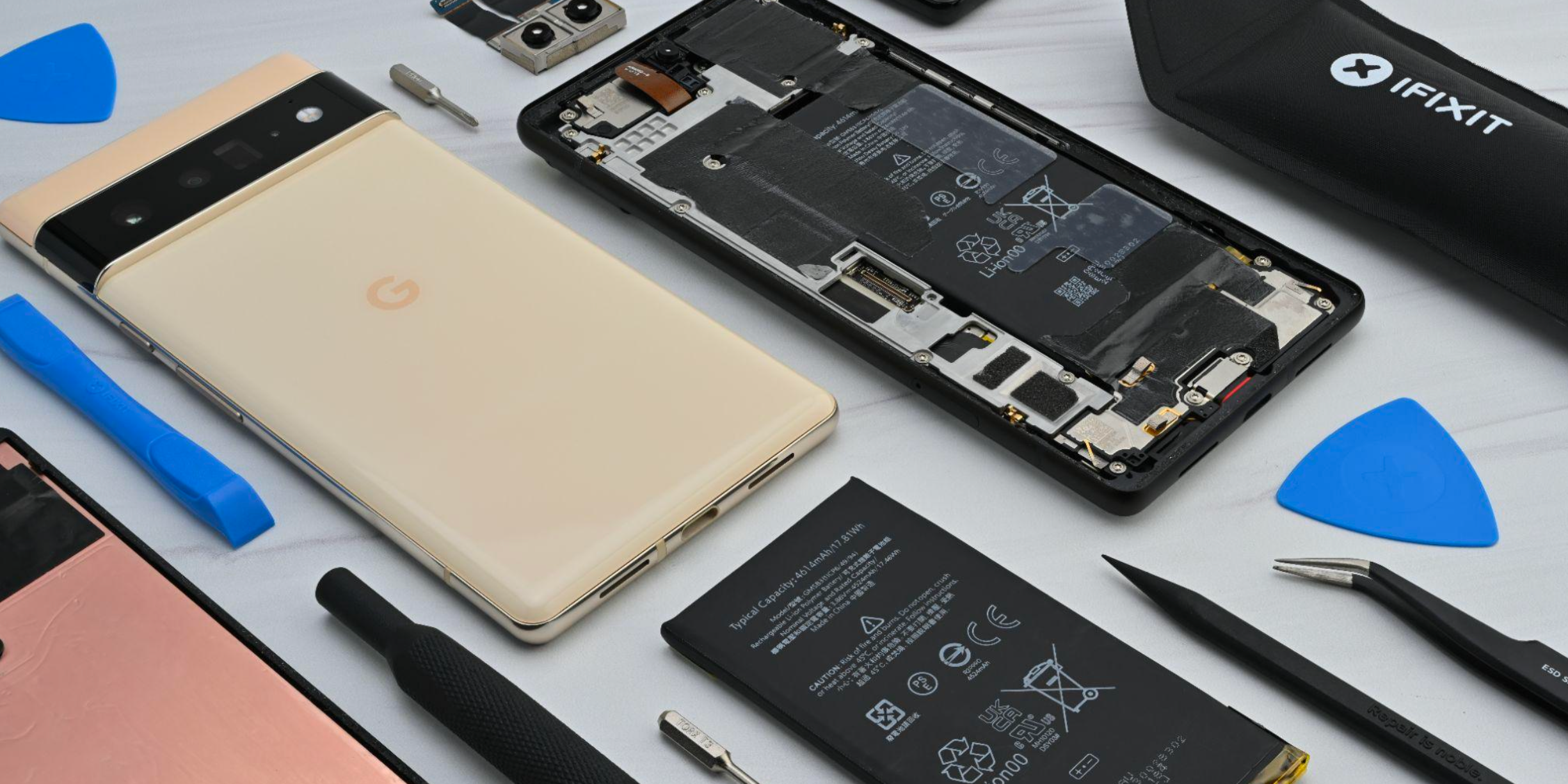 Technician repairing a Google Pixel phone at the ASM Wireless bench